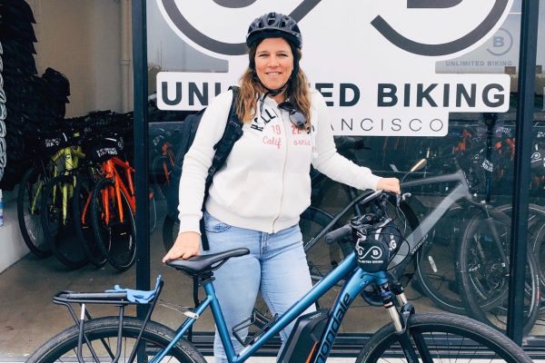 A lady with the unlimited biking E-Bike