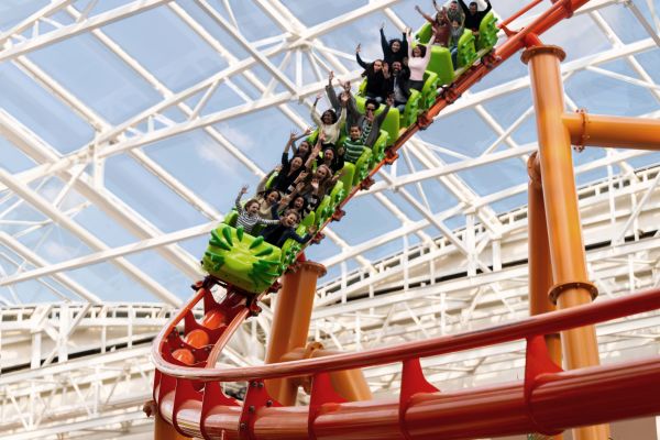 A group of people on the roller coaster at the Nickelodeon universe