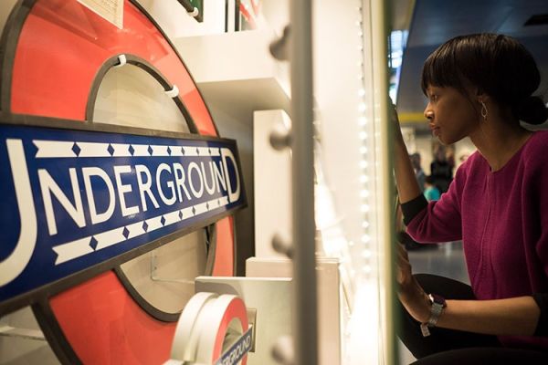 A woman views the underground at the London Transport Museum