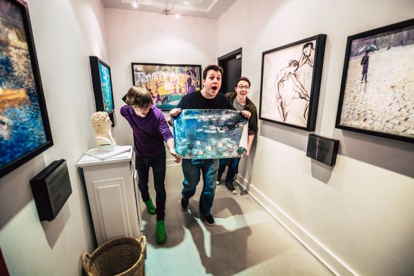 A group with a stolen painting at the Escape Game - The Heist