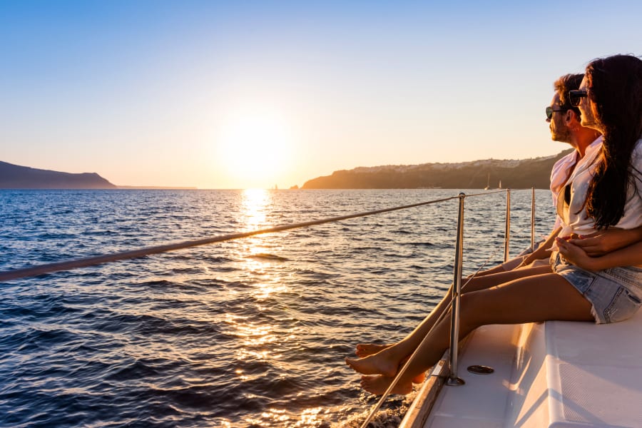 Couple at sunset during Caldera Sunset Sail premium experience