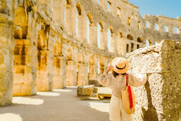 "Colosseum architecture and history"
"Roman tunnels and chambers beneath Colosseum"
"View of Rome from upper tiers of Colosseum"
"Roman amphitheater seating and hierarchy"
"Knowledgeable tour guide at Colosseum"