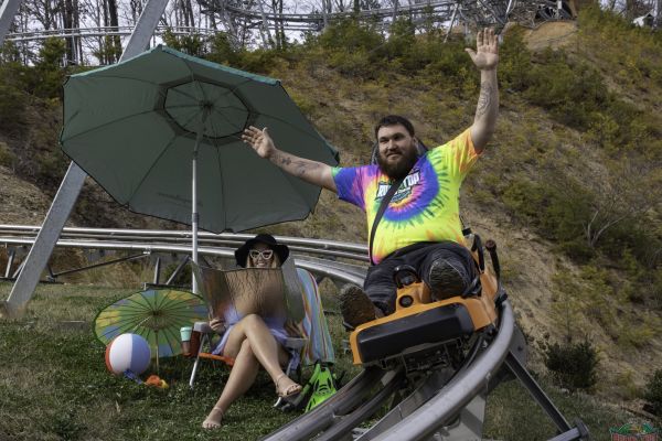 A man and a woman having a picnic at the Rocky Top Mountain Coaster