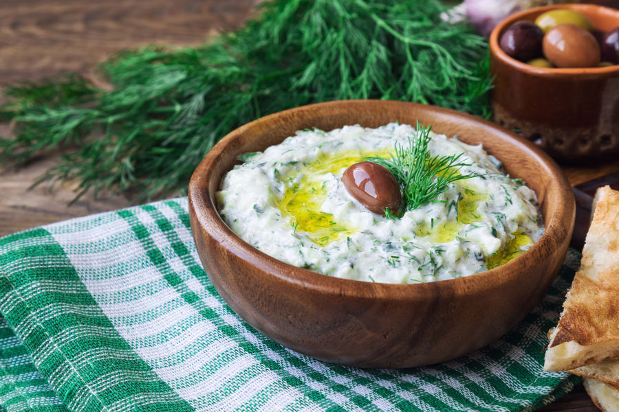 Tzatziki sauce in wooden bowl