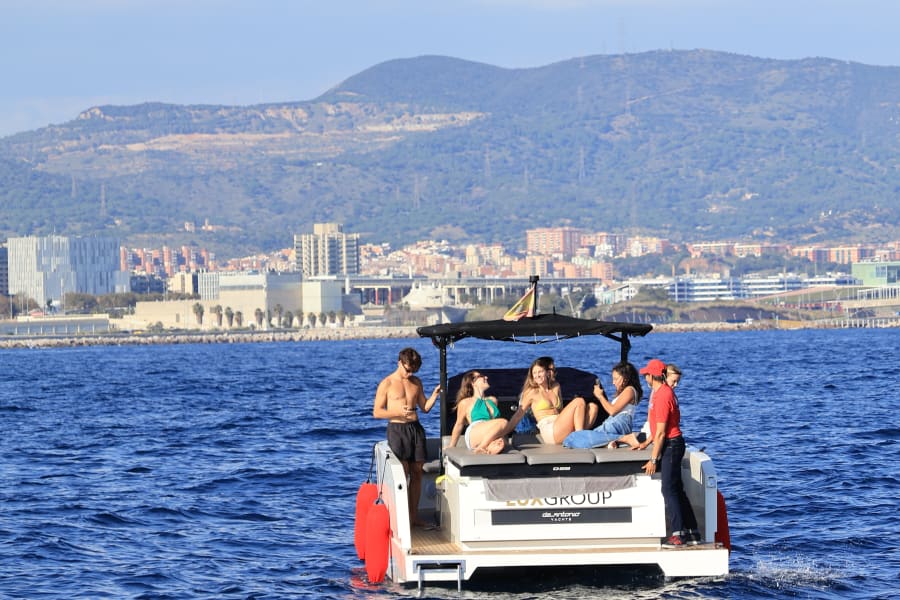 Group of people in motorboat during Barcelona to Sitges premium sailing experience