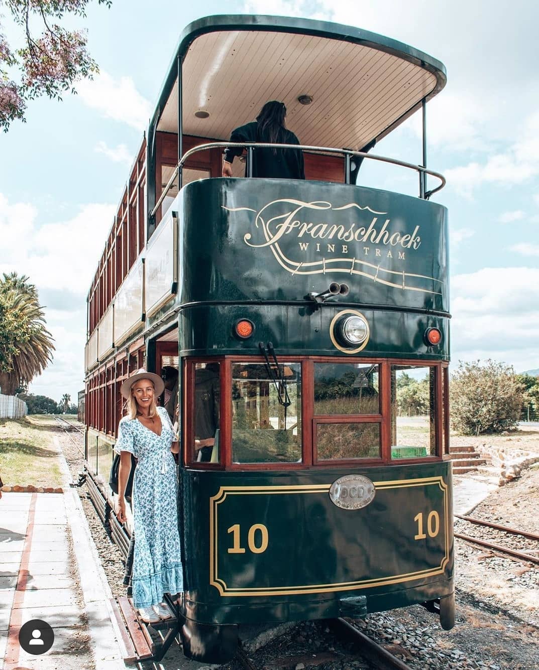 A happy passenger about to board the Franschhoek Wine Tram