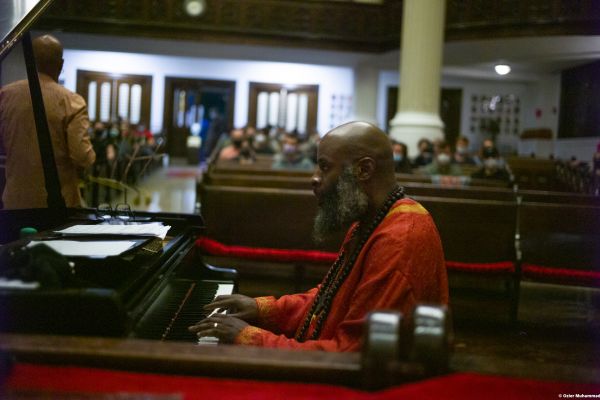 A man playing the Piano at the Harlem Jazz Series