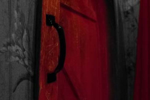 A red door at the Number One Escape Room - choice of one game