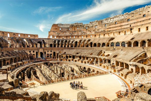 "Inside view of the Colosseum seating"
"Colosseum underground tunnels and chambers"
"Panoramic view from the Colosseum upper tiers"
"Detail of Colosseum arches and columns"
"Colosseum interior during guided tour"