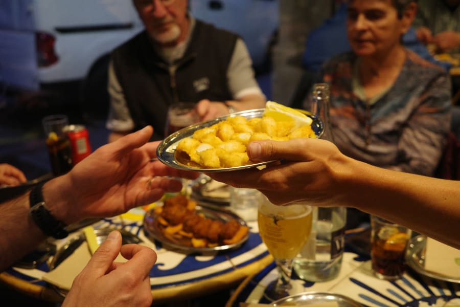Hand passing tapas during private Barceloneta tapas tour