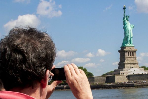 Taking a picture of the Statue of Liberty from the Cruise Ship