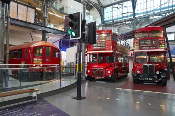 A train and two double-decker buses at the London Transport Museum
