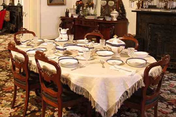 A dinning room settings at The 1850 House