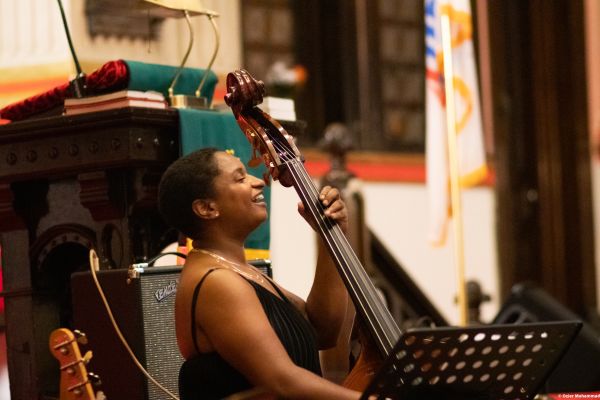 A lady playing the Cello at the Harlem Gospel Series