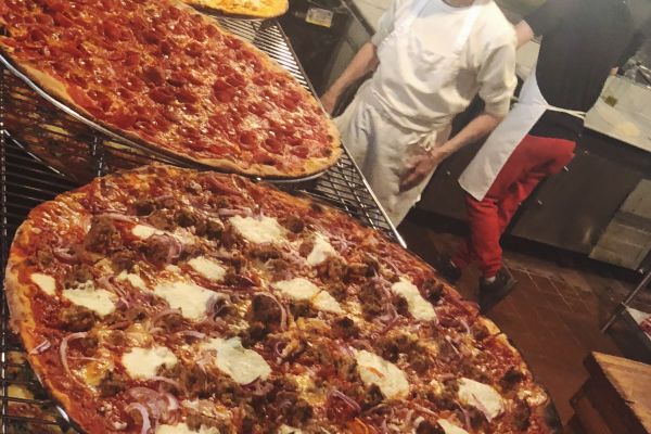 A pizza factory stop on the Food On Food Midtown Mix Guided Tour
