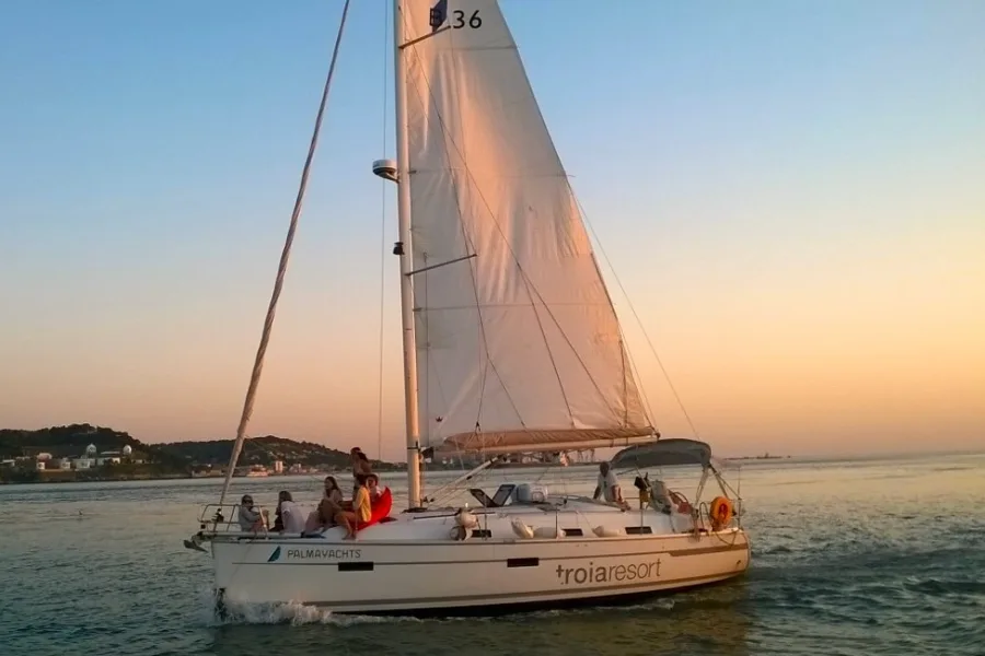 View of guests and private yacht in the waters during Sunset Sail in Lisbon