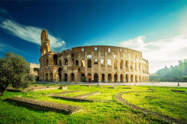 "Colosseum exterior view in Rome"
"Ancient Roman amphitheater architecture"
"Historic landmark Colosseum in Italy"
"Iconic Roman Colosseum at sunset"
"Tourists visiting the Colosseum ruins"