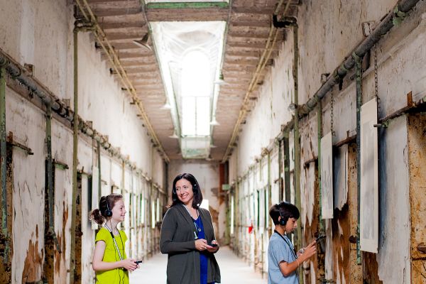 A lady and two kids on the guided Eastern State Penitentiary Tour